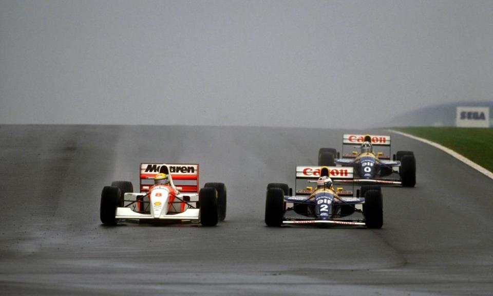 McLaren’s Ayrton Senna (left) takes the lead from Williams’ Alain Prost on the first lap of the 1993 European Grand Prix at Donington Park.