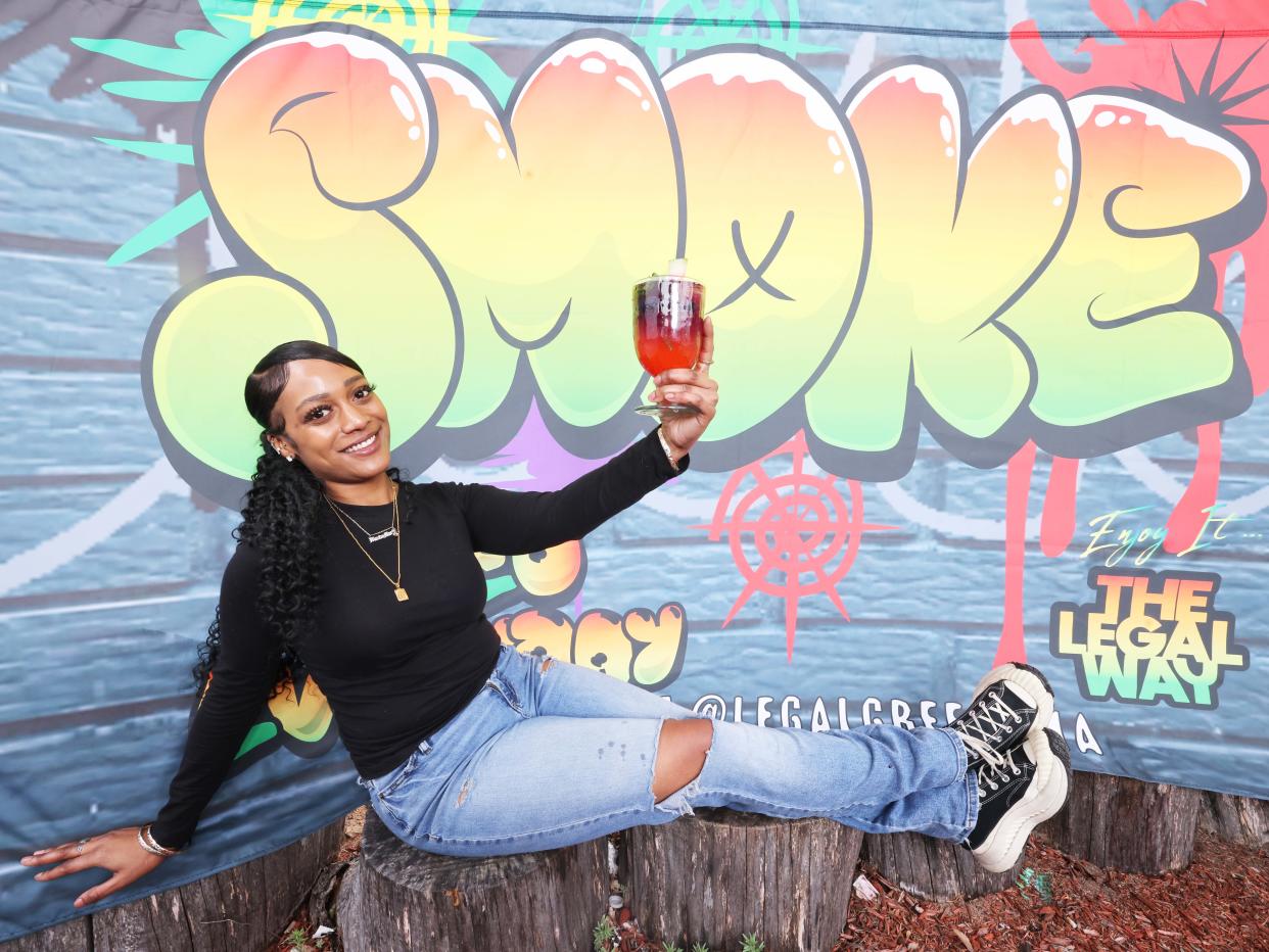 Amanda Barros outside Legal Greens with a cannabis-infused drink in Brockton on Wednesday, April 17, 2024.