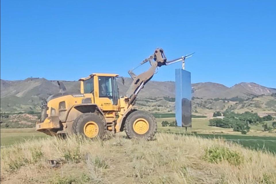 A mysterious monolith that appeared in a Colorado dairy farm last month has been removed by the owners after too many visitors came to view the strange object (Morning Fresh Farm/ Facebook)