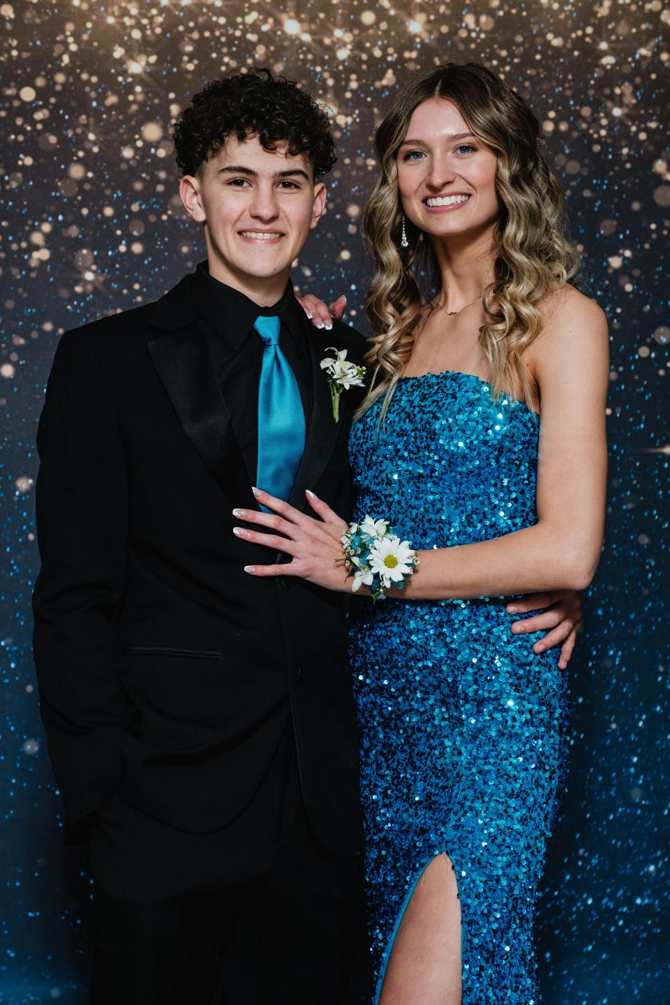 Austen Gunn, a senior, accompanies his good friend, Caroline Hanner, a sophomore, during Indian Valley's prom, Saturday, at the Kent State University Tuscarawas Performing Arts Center. To view more photos visit news@timesreporter.com .