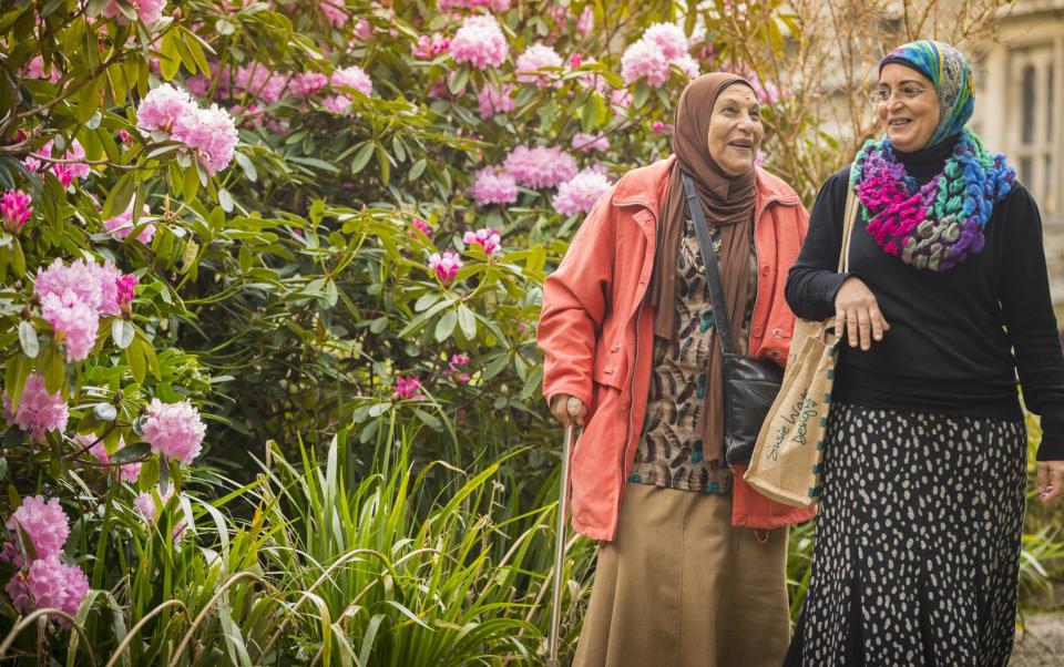 Two women exploring the gardens at Cotehele, Cornwall