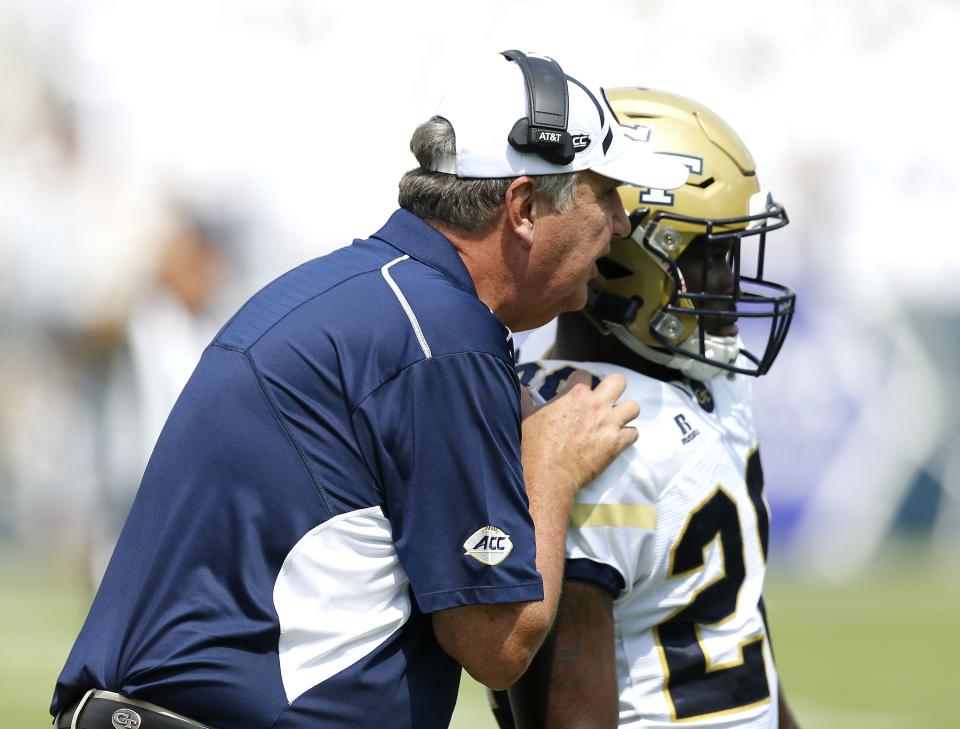ATLANTA, GA – SEPTEMBER 23: Georgia Tech Yellow Jackets head coach Paul Johnson sends a play in via running back J.J. Green #28 of the Georgia Tech Yellow Jackets during the game against the Pittsburgh Panthers at Bobby Dodd Stadium on September 23, 2017 in Atlanta, Georgia. (Photo by Mike Zarrilli/Getty Images)