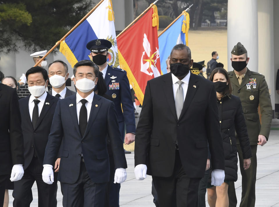 South Korean Defense Minister Suh Wook, center left, and U.S. Defense Secretary Lloyd Austin, center right, walk during their visit to the National Cemetery in Seoul, South Korea, Thursday, March 18, 2021. After giving the Biden administration the silent treatment for two months, North Korea this week marshalled two of the most powerful women in its leadership to warn Washington over combined military exercises with South Korea and the diplomatic consequences of its “hostile” policies toward Pyongyang. (Kim Min-hee/Pool Photo via AP)