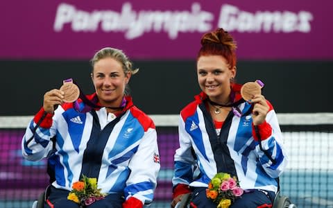 Great Britain's bronze medalist's Lucy Shuker (left) and Jordanne Whiley (right) celebrate with their medal's from the women's double's, at Eton Manor, London - Credit: John Walton/PA