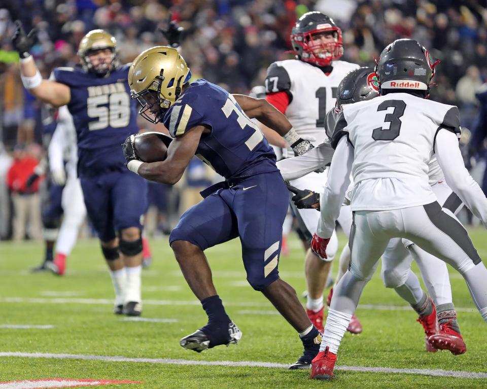 Hoban running back Lamar Sperling scores a first-half TD in the OHSAA Division II state championship game against Toledo Central Catholic at Tom Benson Hall of Fame Stadium, Thursday, Dec. 1, 2022, in Canton.