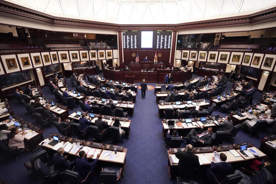 Florida representatives work through a legislative session, Wednesday, April 28, 2021, at the Capitol in Tallahassee, Fla. (AP Photo/Wilfredo Lee)