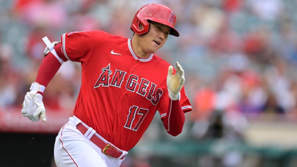 Los Angeles Angels designated hitter Shohei Ohtani (17) rounds the bases on a triple in the first inning against the Texas Rangers at Angel Stadium.