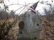 This Dec. 10, 2019, photo shows the gravestone of Revolutionary War soldier William Haven who is buried in a cemetery in Weybridge, Vt., near the edge of an eroding river bank. Rising seas, erosion and flooding from worsening storms that some scientists believe are caused by climate change are putting some older graveyards across the country at risk. (AP Photo/Lisa Rathke)