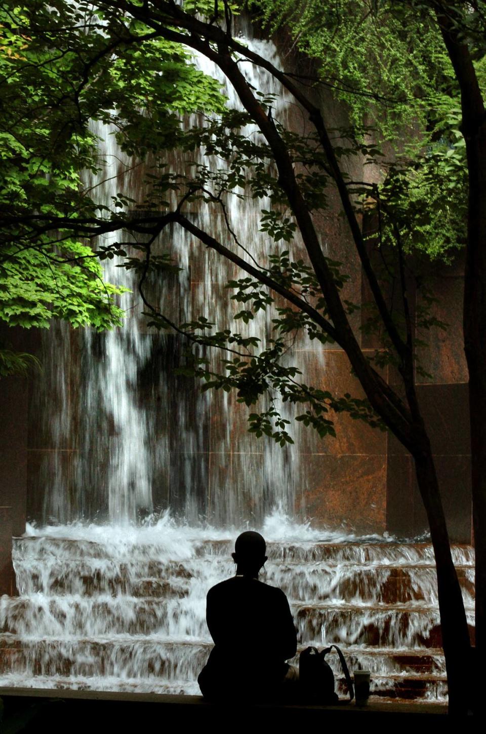 Cascading waters at Thomas Polk Park in 2004 offered a serene retreat for a lunch-time visitor in 2004.