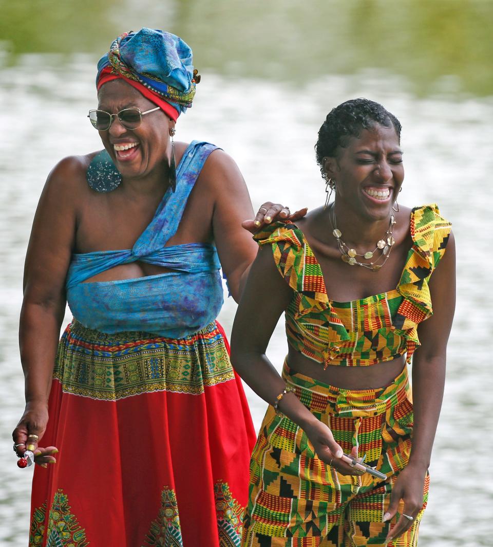 Two women share a laugh during the celebration of Juneteenth in DeLand on June 19, 2021.