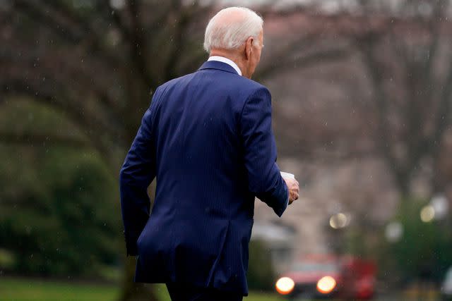 <p>Yuri Gripas/Abaca/Bloomberg via Getty</p> President Joe Biden walks to Marine One with a coffee in hand ahead of his annual physical exam on Feb. 28, 2024