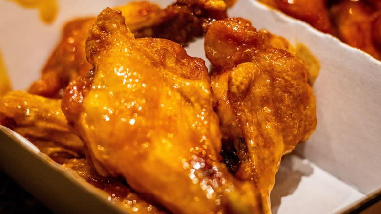 Honey garlic wings in takeout box