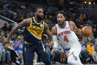 New York Knicks' Derrick Rose (4) goes to the basket against Indiana Pacers' Brad Wanamaker (10) during the first half of an NBA basketball game Wednesday, Dec. 8, 2021, in Indianapolis. (AP Photo/Darron Cummings)