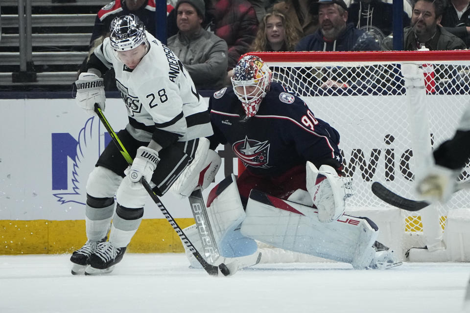 Los Angeles Kings' Jaret Anderson-Dolan (28) skates in on Columbus Blue Jackets goaltender Elvis Merzlikins (90) in the second period of an NHL hockey game Tuesday, Dec. 5, 2023, in Columbus, Ohio. (AP Photo/Sue Ogrocki)