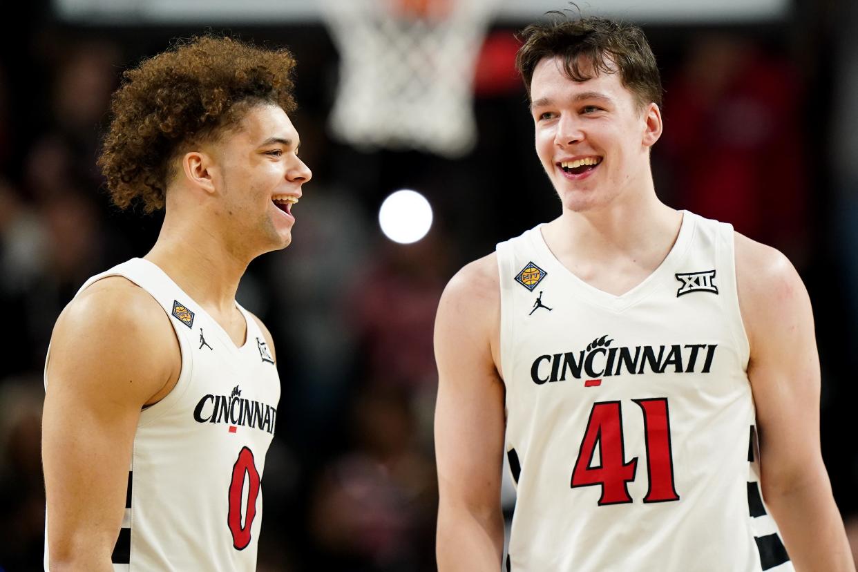 Cincinnati Bearcats guard Dan Skillings Jr. (0) congratulates Cincinnati Bearcats guard Simas Lukosius (41) on his game-winning 3-pointer vs. San Francisco in their NIT win Wednesday night.