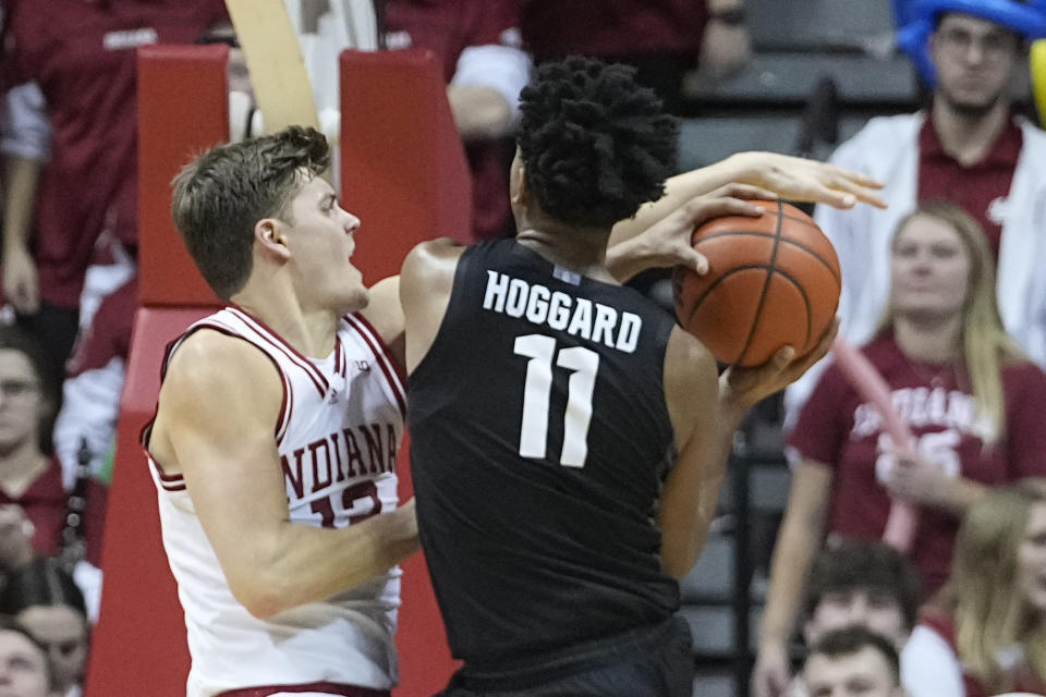 Michigan State's A.J. Hoggard (11) puts up a shot against Indiana's Miller Kopp during the second half of an NCAA college basketball game, Sunday, Jan. 22, 2023, in Bloomington, Ind. (AP Photo/Darron Cummings)