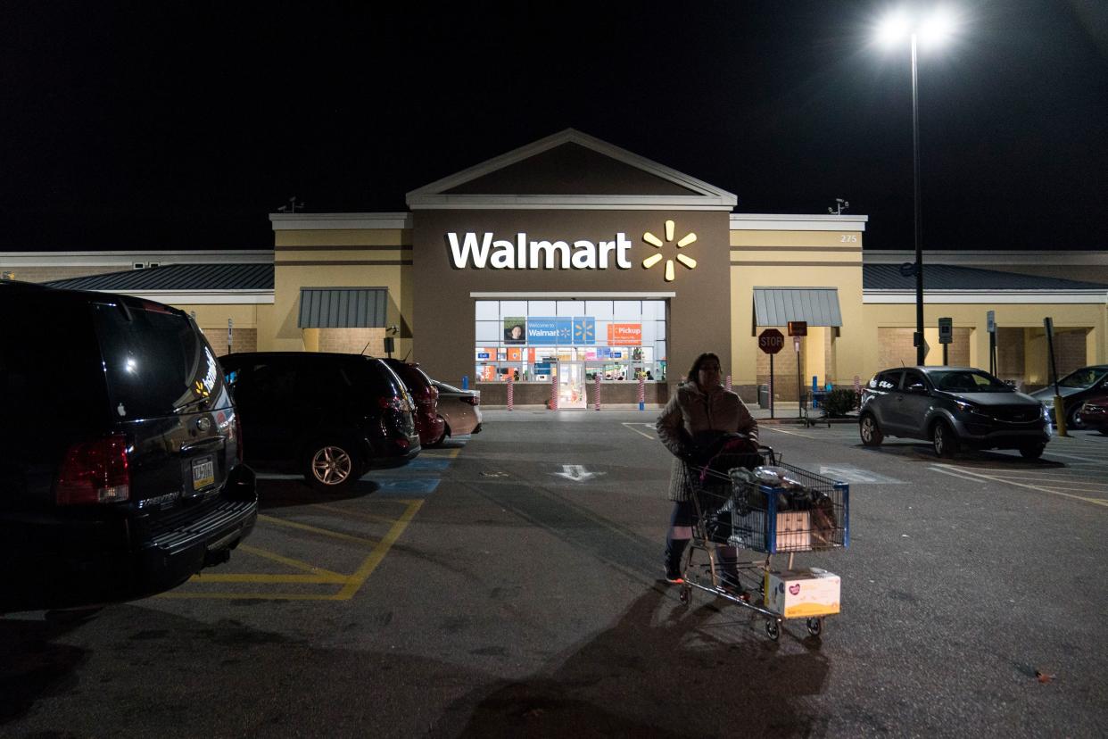 A woman leaves Walmart on Thanksgiving night ahead of Black Friday on November 28, 2019 in King of Prussia, United States.
