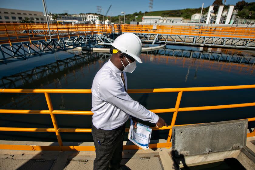 PLAYA DEL REY, CA - AUGUST 04: Tim Dafeta, Plant Manager of the City of Los Angeles Hyperion Water Reclamation Plant, shows the progress they have made in cleaning up the water quality of one of the Final Clarifier tanks following a massive raw sewage spill into Santa Monica Bay on Wednesday, Aug. 4, 2021 in Playa Del Rey, CA. (Jason Armond / Los Angeles Times)