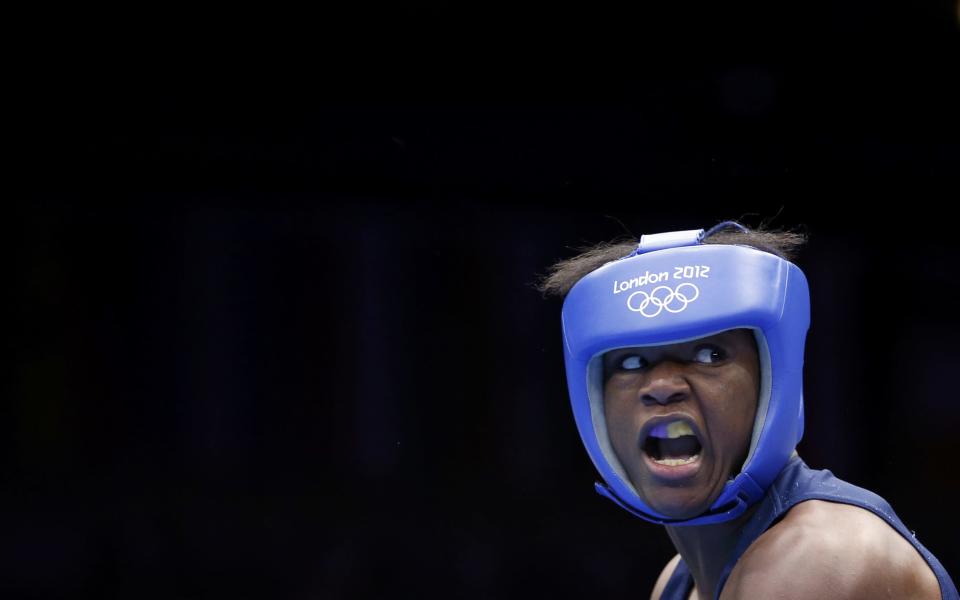 Claressa Shields of the U.S. fights Kazakhstan's Marina Volnova (not shown) during their Women's Middle (75kg) semi-final boxing match at the London Olympic Games August 8, 2012. REUTERS/Damir Sagolj (BRITAIN - Tags: SPORT BOXING OLYMPICS TPX IMAGES OF THE DAY) 