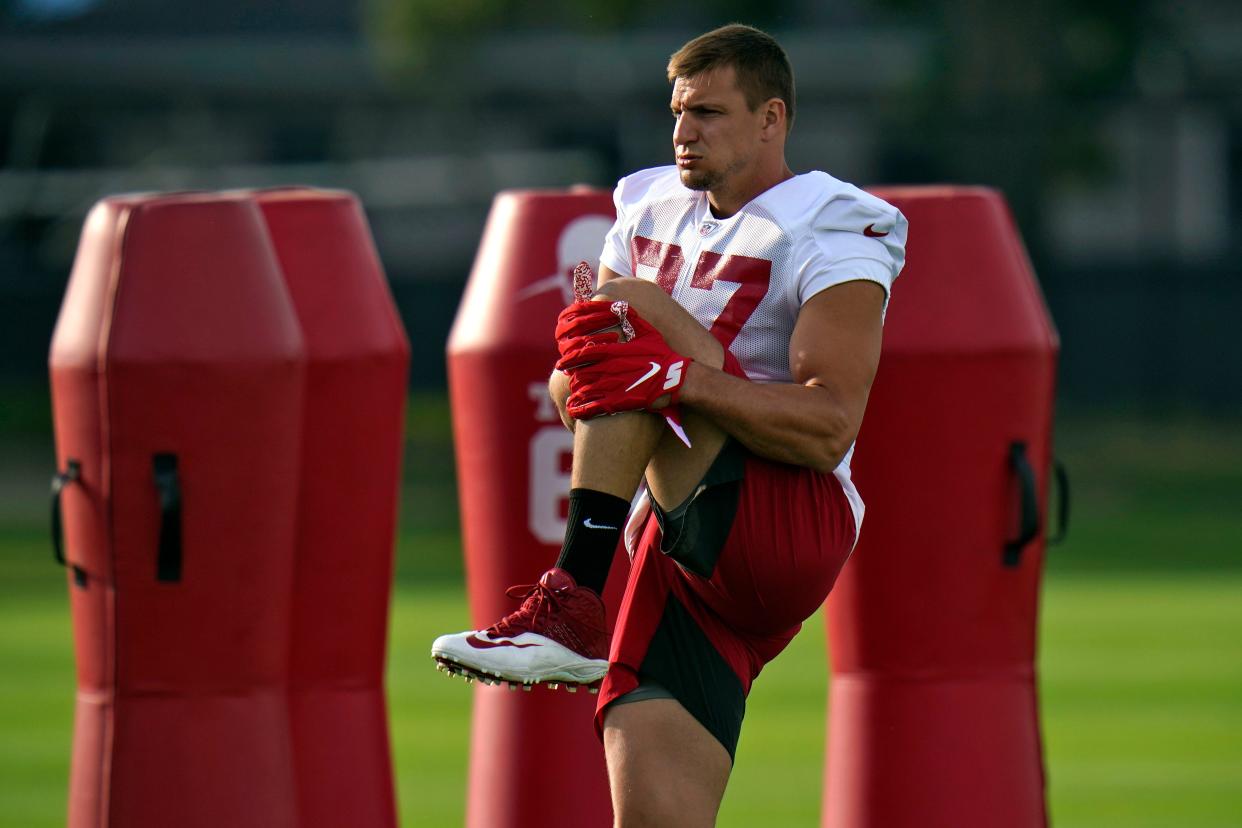 Tampa Bay Buccaneers tight end Rob Gronkowski (87) stretches during an NFL football practice Tuesday, July 27, 2021, in Tampa, Fla.