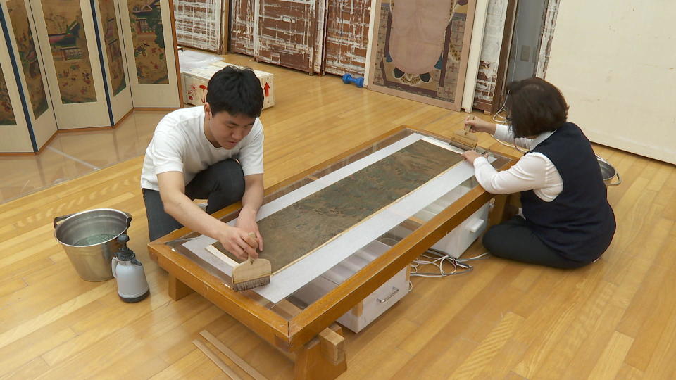 Because of its strength and versatility, hanji paper has been used for fans, screens, clothing, or as a canvas for fine art. / Credit: CBS News