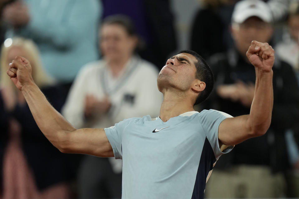 Spain's Carlos Alcaraz celebrates winning against Sebastian Korda of the U.S. in three sets, 6-4, 6-4, 6-2, during their third round match at the French Open tennis tournament in Roland Garros stadium in Paris, France, Friday, May 27, 2022. (AP Photo/Thibault Camus)