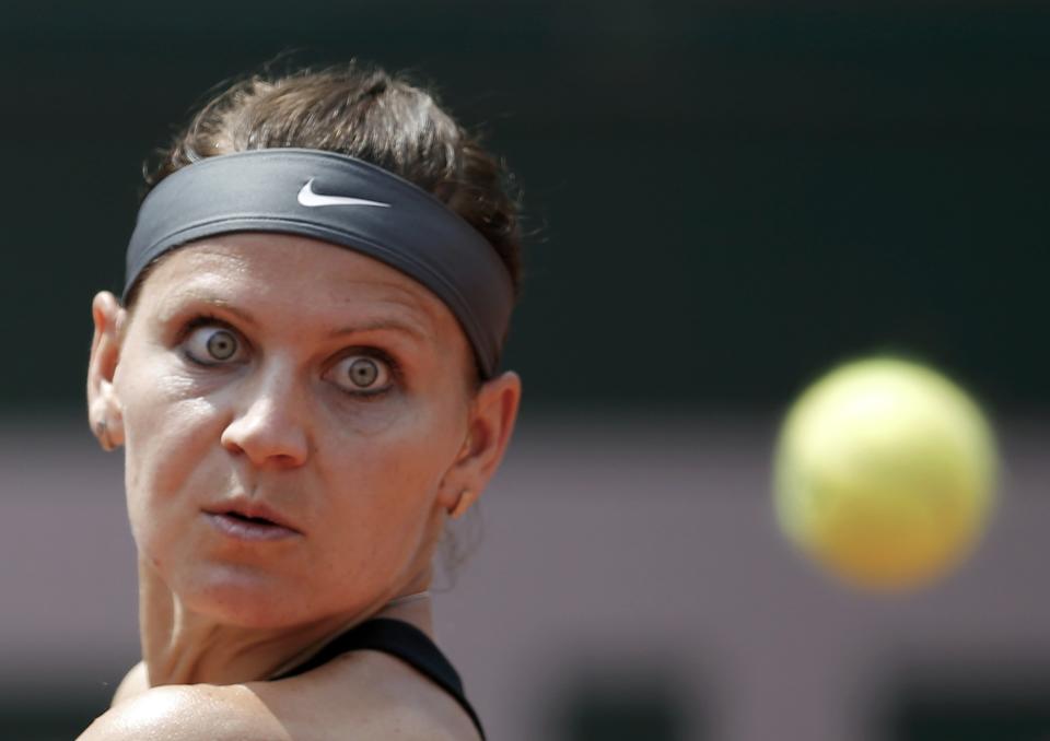 Lucie Safarova of the Czech Republic eyes the ball during her women's singles match against Ana Ivanovic of Serbia at the French Open tennis tournament at the Roland Garros stadium in Paris