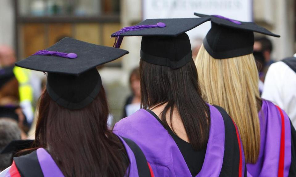 Back view of students in graduation robes