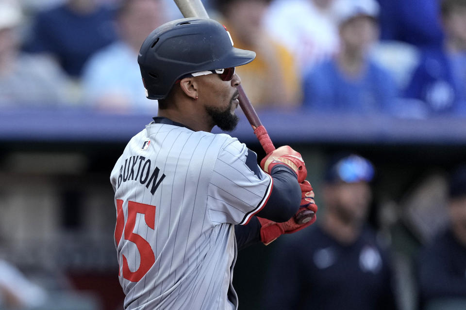 Minnesota Twins center fielder Byron Buxton watches his two-run double during the ninth inning of a baseball game against the Kansas City Royals Saturday, March 30, 2024, in Kansas City, Mo. The Twins won 5-1. (AP Photo/Charlie Riedel)