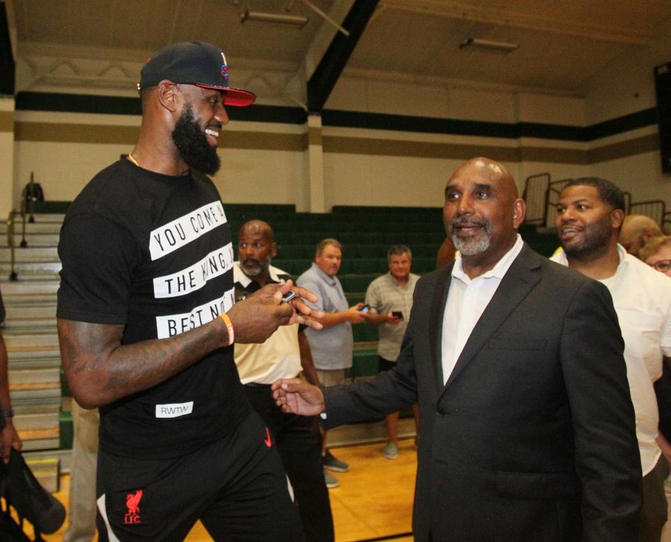 LeBron James shares a laugh with his former coach Dru Joyce II after the dedication ceremony to name the court Coach Dru Joyce Court at LeBron James Arena at St. Vincent-St. Mary High School, Sunday, July 24, 2022.