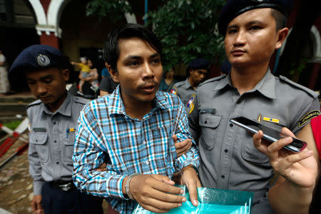 Detained Reuters journalist Kyaw Soe Oo leaves the Insein court in Yangon, Myanmar July 16, 2018. REUTERS/Ann Wang