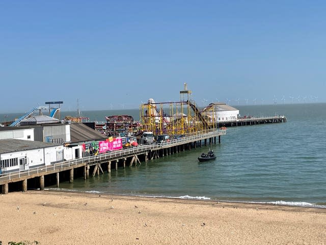A boat next to Clacton Pier 