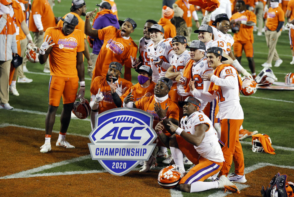 CHARLOTTE, NORTH CAROLINA - DECEMBER 19: Clemson Tigers players pose after defeating the Notre Dame Fighting Irish 34-10 in the ACC Championship game at Bank of America Stadium on December 19, 2020 in Charlotte, North Carolina. (Photo by Jared C. Tilton/Getty Images)