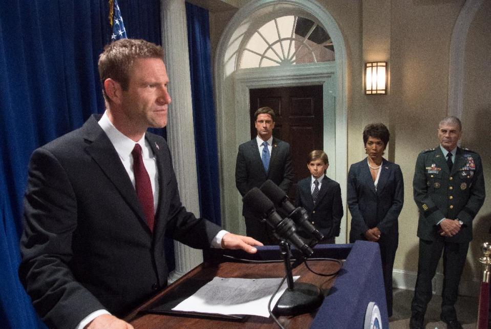 This film image released by FilmDistrict shows, from left, Aaron Eckhart, Gerard Butler, Finley Jacobsen, Angela Bassett and Robert Forster in a scene from "Olympus Has Fallen." (AP Photo/FilmDistrict, Phil Caruso)