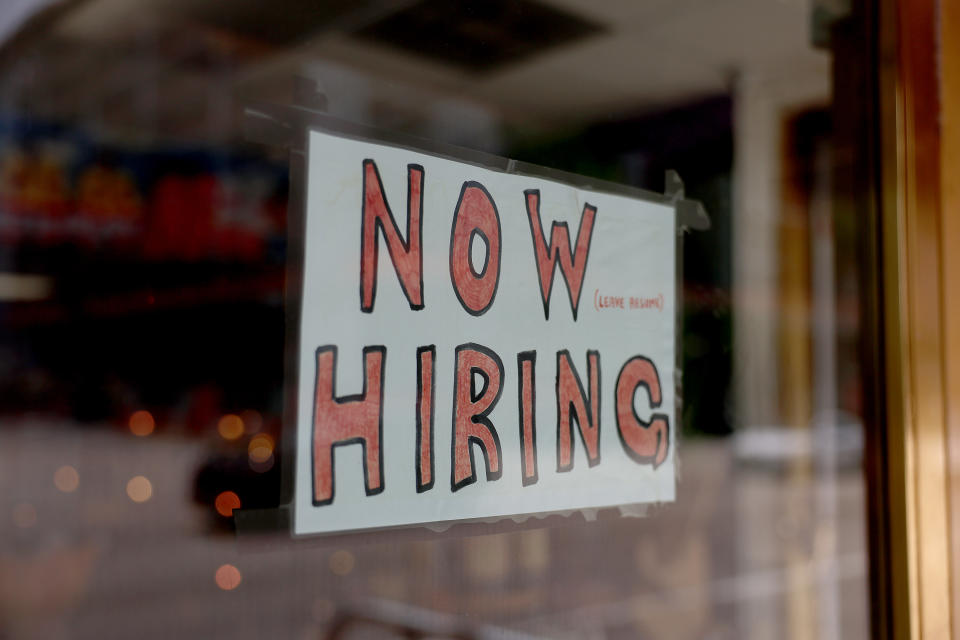 MIAMI, FLORIDA - MAY 05: A 'Now Hiring' sign posted on the window of a business looking to hire workers on May 05, 2023 in Miami, Florida. A report by the Bureau of Labor Statistics showed the US economy added 253,000 jobs in April.  (Photo by Joe Raedle/Getty Images)