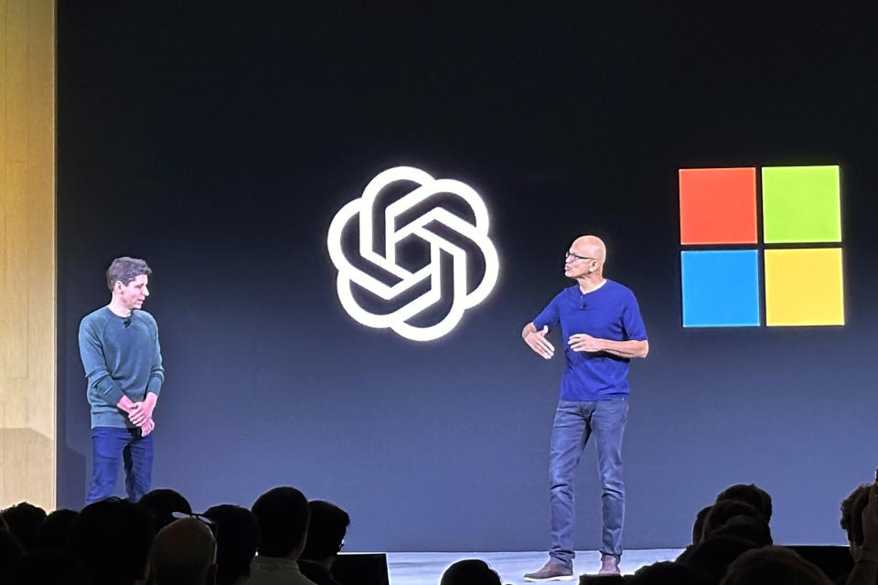 File - Sam Altman, left, appears onstage with Microsoft CEO Satya Nadella at OpenAI's first developer conference, on Nov. 6, 2023, in San Francisco. Microsoft snapped up Altman for a new venture after his sudden departure from OpenAI shocked the artificial intelligence world. (AP Photo/Barbara Ortutay, File)