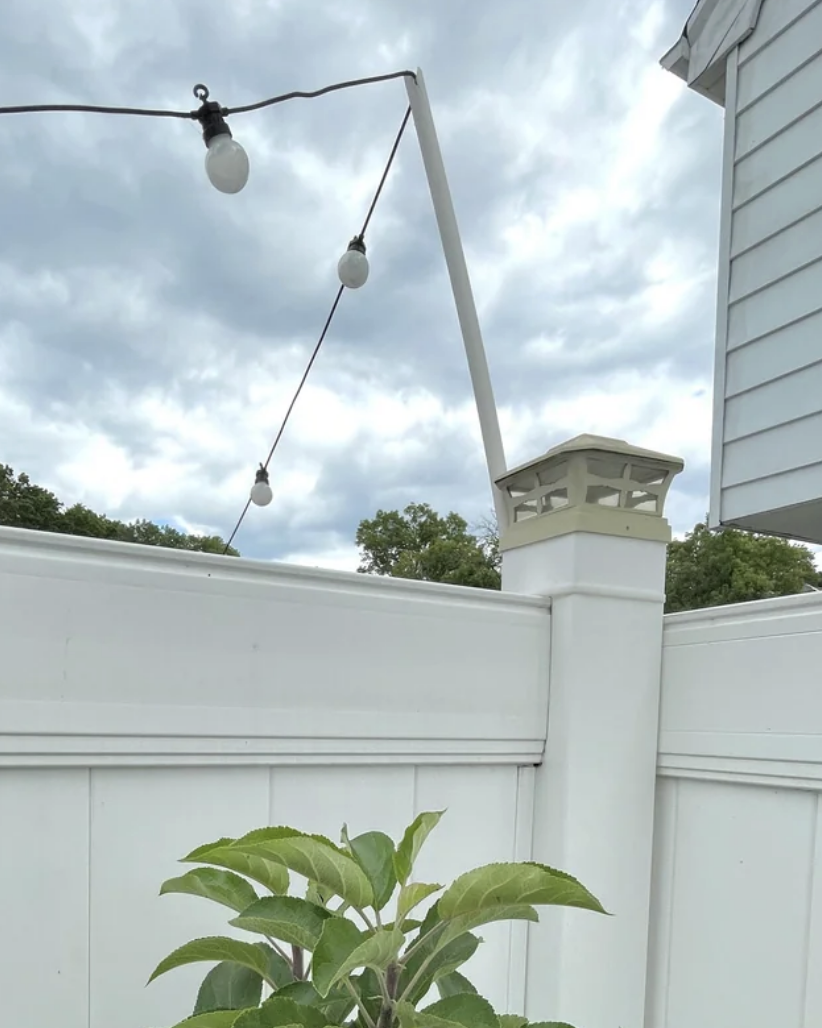 Outdoor lights sitting atop a flimsy rod