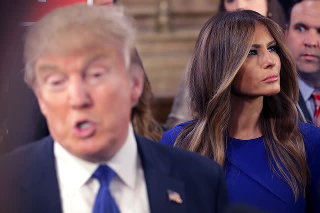 <p>Chip Somodevilla/Getty Images</p> Donald and Melania Trump greet reporters following a 2016 GOP presidential debate in Detroit