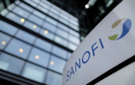 A logo is seen in front of the entrance at the headquarters French drugmaker Sanofi in Paris October 30, 2014. REUTERS/Christian Hartmann/File Photo