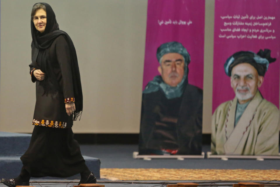 Afghan presidential candidate Ashraf Ghani Ahmadzai's wife Rula Ghani walks on the stage as she prepares to speak during a campaign rally for women a day after International Women's Day in Kabul, Afghanistan, Sunday, March 9, 2014. Ten Afghan presidential candidates are campaigning in the presidential election scheduled for April. (AP Photo/Massoud Hossaini)