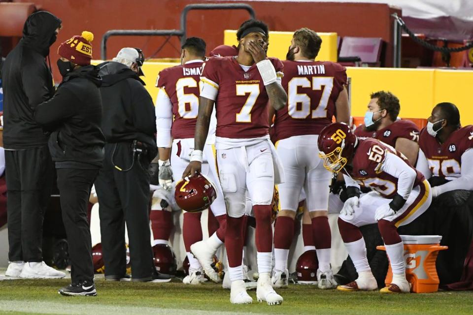 LANDOVER, MARYLAND - DECEMBER 27: Dwayne Haskins #7 of the Washington Football Team reacts on the sideline against the Carolina Panthers during the fourth quarter at FedExField on December 27, 2020 in Landover, Maryland. (Photo by Will Newton/Getty Images)