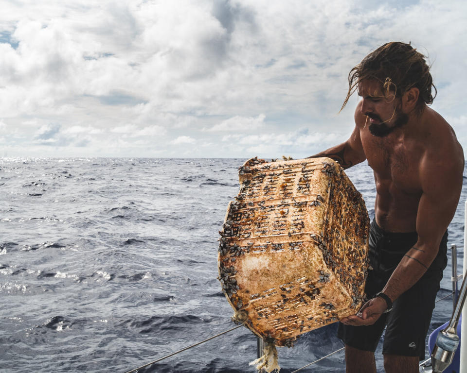 A member of the Vortex Swim team holds a laundry hamper or storage basket covered in aquatic life. (Photo: <a href="https://www.instagram.com/p/BzN1ioIhM73/" target="_blank">@dwlangdon/The Vortex Swim</a>)