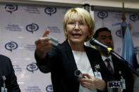 Venezuela's chief prosecutor Luisa Ortega Diaz displays a tear gas canister as she talks to the media during a news conference in Caracas, Venezuela May 24, 2017. REUTERS/Marco Bello