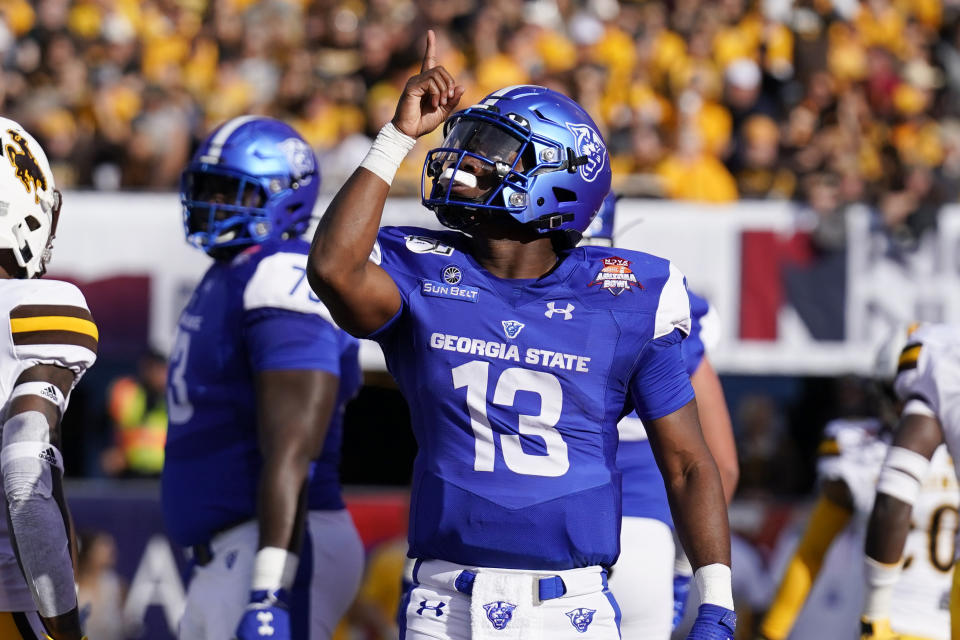 Georgia State quarterback Dan Ellington (13) reacts after scoring a touchdown against Wyoming during the first half of the Arizona Bowl college football game Tuesday, Dec. 31, 2019, in Tucson, Ariz. (AP Photo/Rick Scuteri)