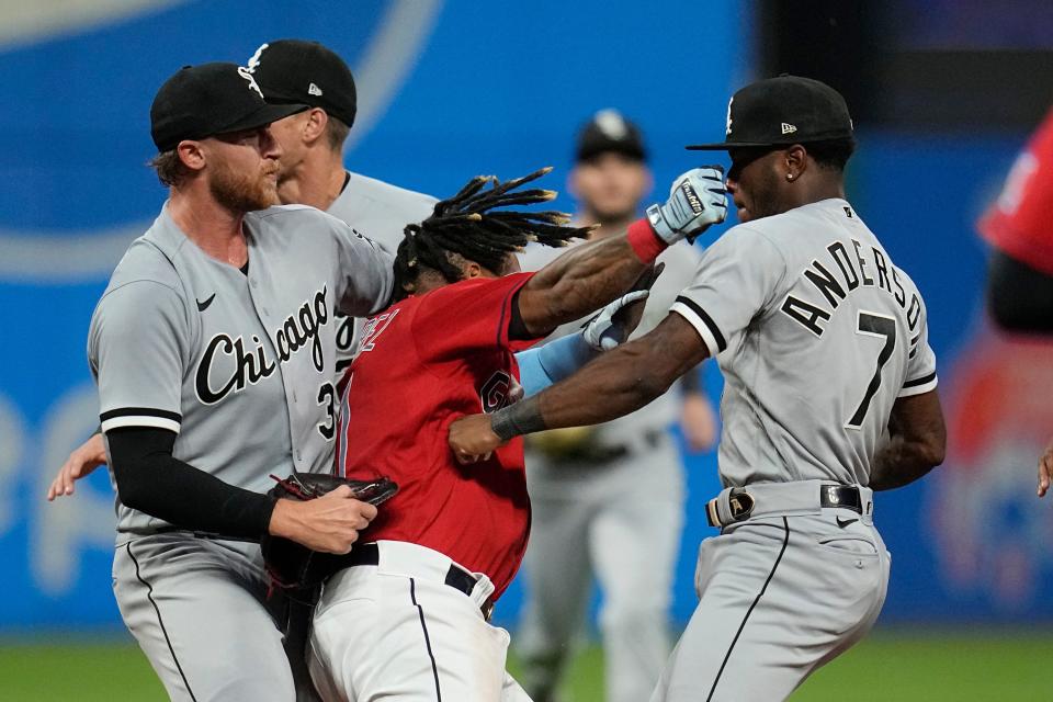 Cleveland Guardians' Jose Ramirez, center, and Chicago White Sox's Tim Anderson (7) exchange punches on Aug. 5 in Cleveland.