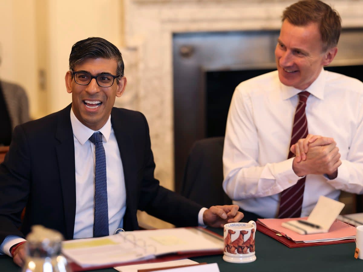 Rishi Sunak and Jeremy Hunt are once more under pressure from Tory MPs to cut taxes (Downing Street)