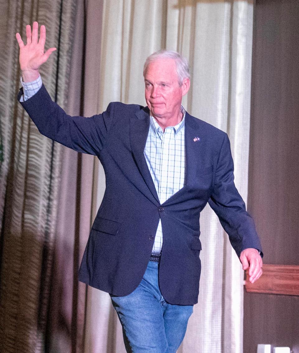 U.S. Sen. Ron Johnson waves to his supporters before giving a statement about the election results Wednesday in Neenah.