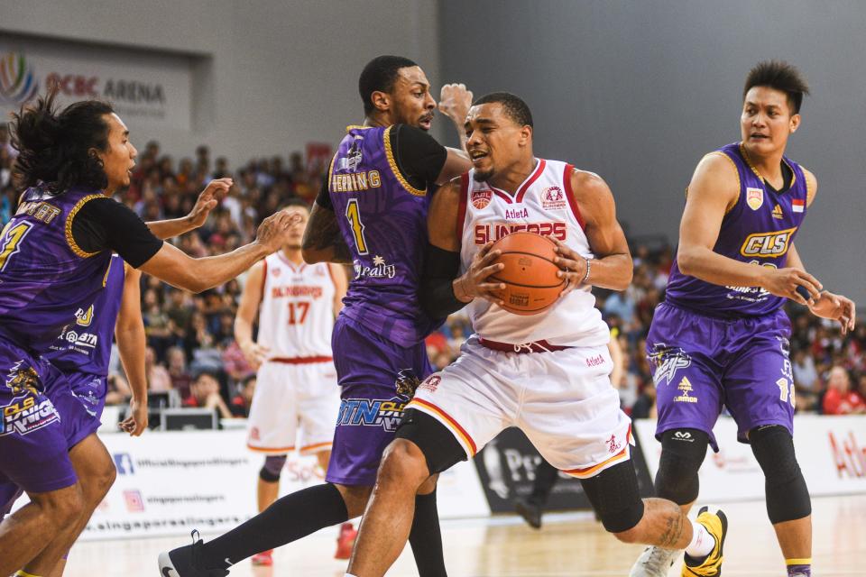 The Singapore Slingers' Xavier Alexander (with ball) in action against CSL Knights Indonesia during Game One of the Asean Basketball League Finals. (PHOTO: Iman Hashim/Yahoo News Singapore)
