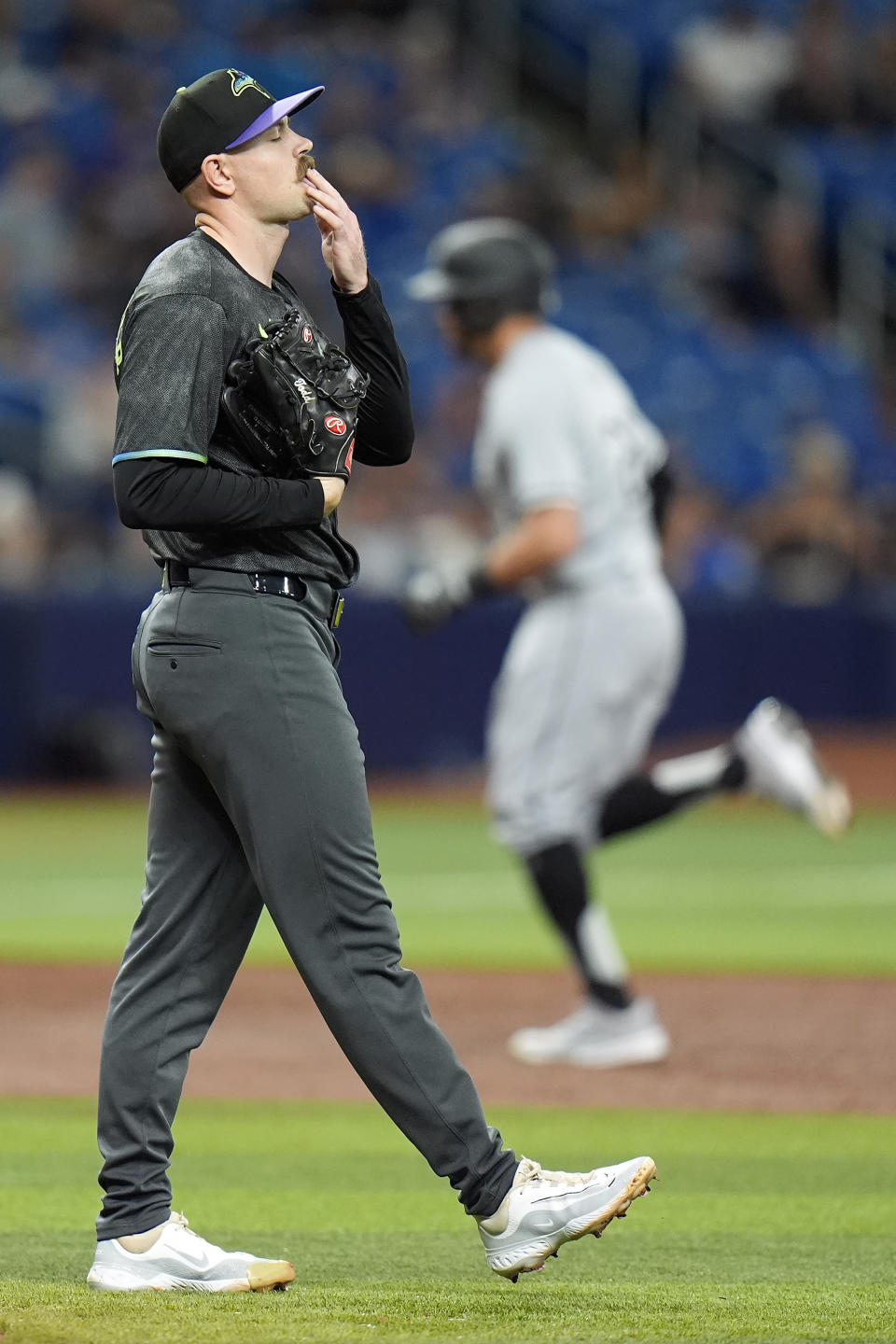 Tampa Bay Rays starting pitcher Tyler Alexander reacts as Chicago White Sox's Tommy Pham runs around the bases after his two-run home run during the third inning of a baseball game Monday, May 6, 2024, in St. Petersburg, Fla. (AP Photo/Chris O'Meara)