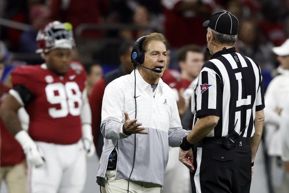 Alabama head coach Nick Saban, left, talks with a game official during the first half of the Sugar Bowl NCAA college football game against Kansas State, Saturday, Dec. 31, 2022, in New Orleans. (AP Photo/Butch Dill)
